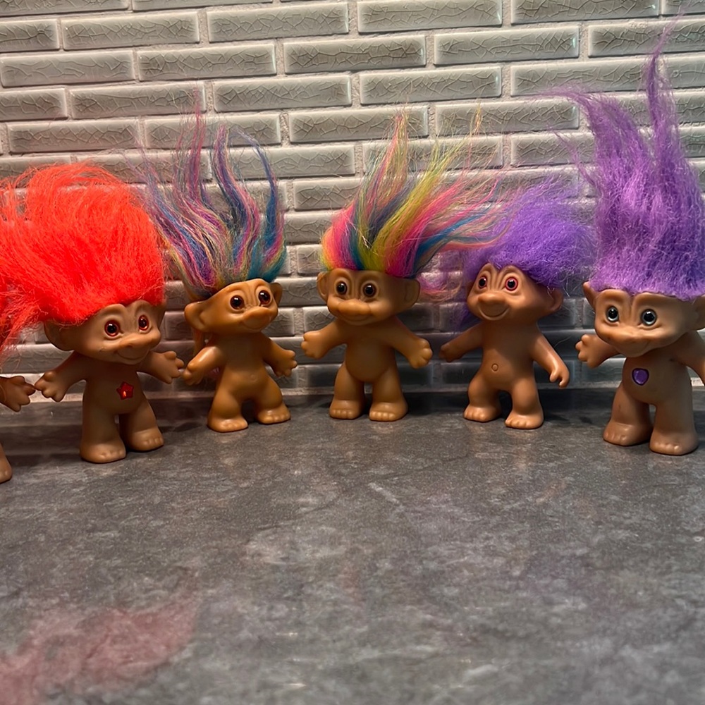 Lot of orange, rainbow, and purple trolls
